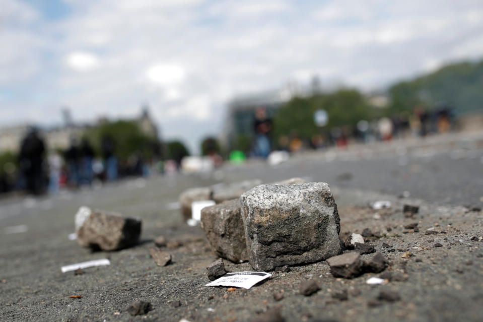 <p>Paving stones are scattered on the street after clashes at the May Day labour union rally in Paris, France, May 1, 2018. (Photo: Christian Hartmann/Reuters) </p>