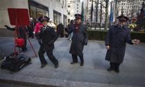 Salvation Army members sing and dance at Rockefeller Center during Black Friday Sales in New York November 29, 2013. Black Friday, the day following Thanksgiving Day holiday, has traditionally been the busiest shopping day in the United States. REUTERS/Carlo Allegri