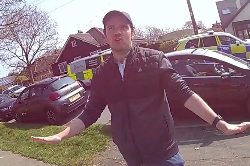 Luke D'Wit, the man who murdered Stephen and Carol Baxter, being interviewed by police outside their home shortly after the deaths