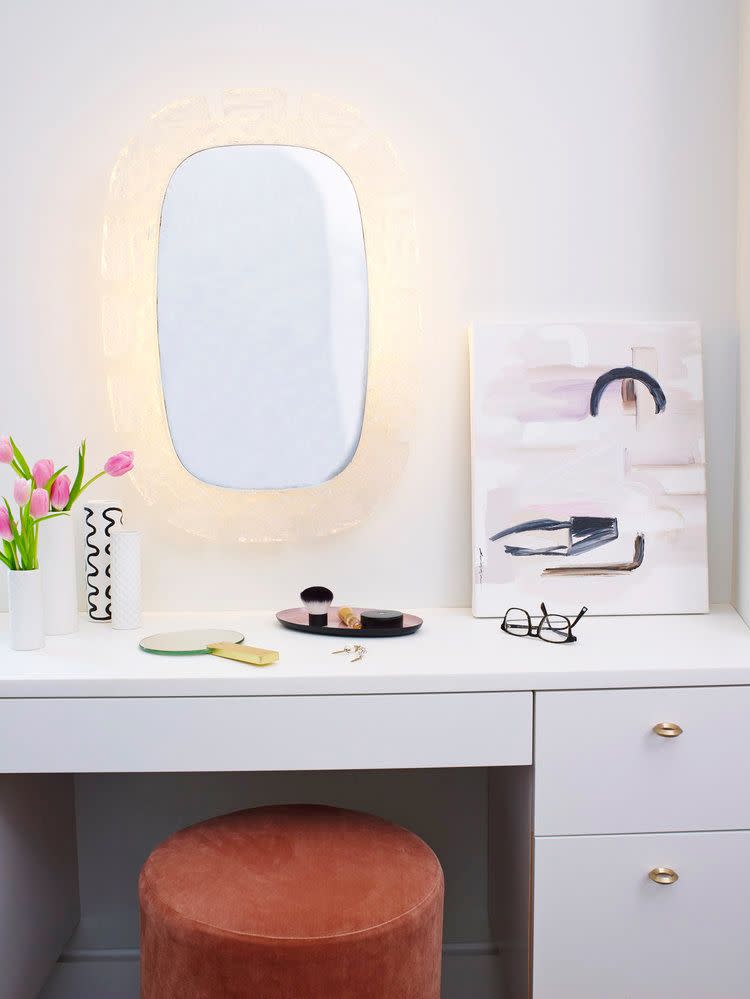 <p>The velvet stool and light-up mirror make makeup application easier and more style in this Studio DB-designed space. A vanity is a perfect addition to the main bathroom. So if space allows, take note. </p>