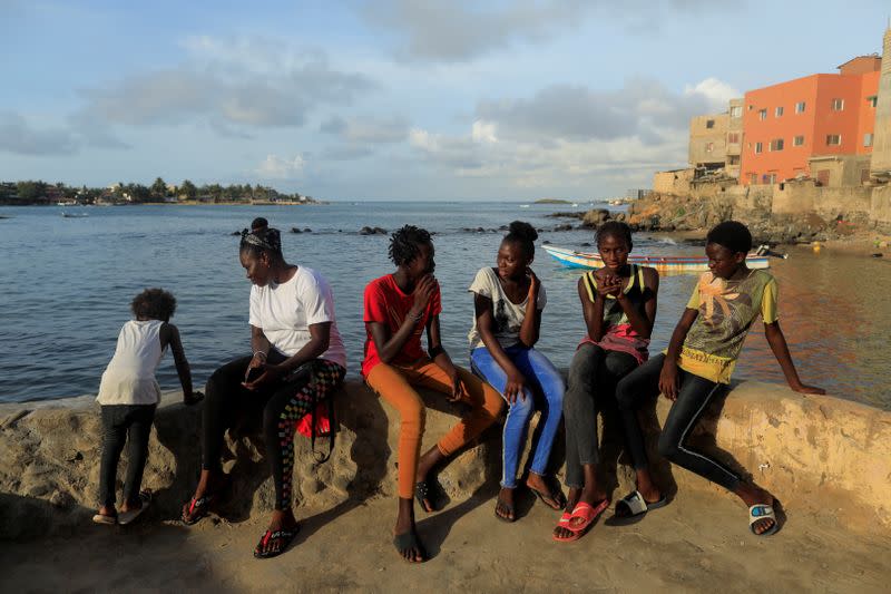 Wider Image: Meet Senegal's first female pro surfer inspiring girls to take to the waves