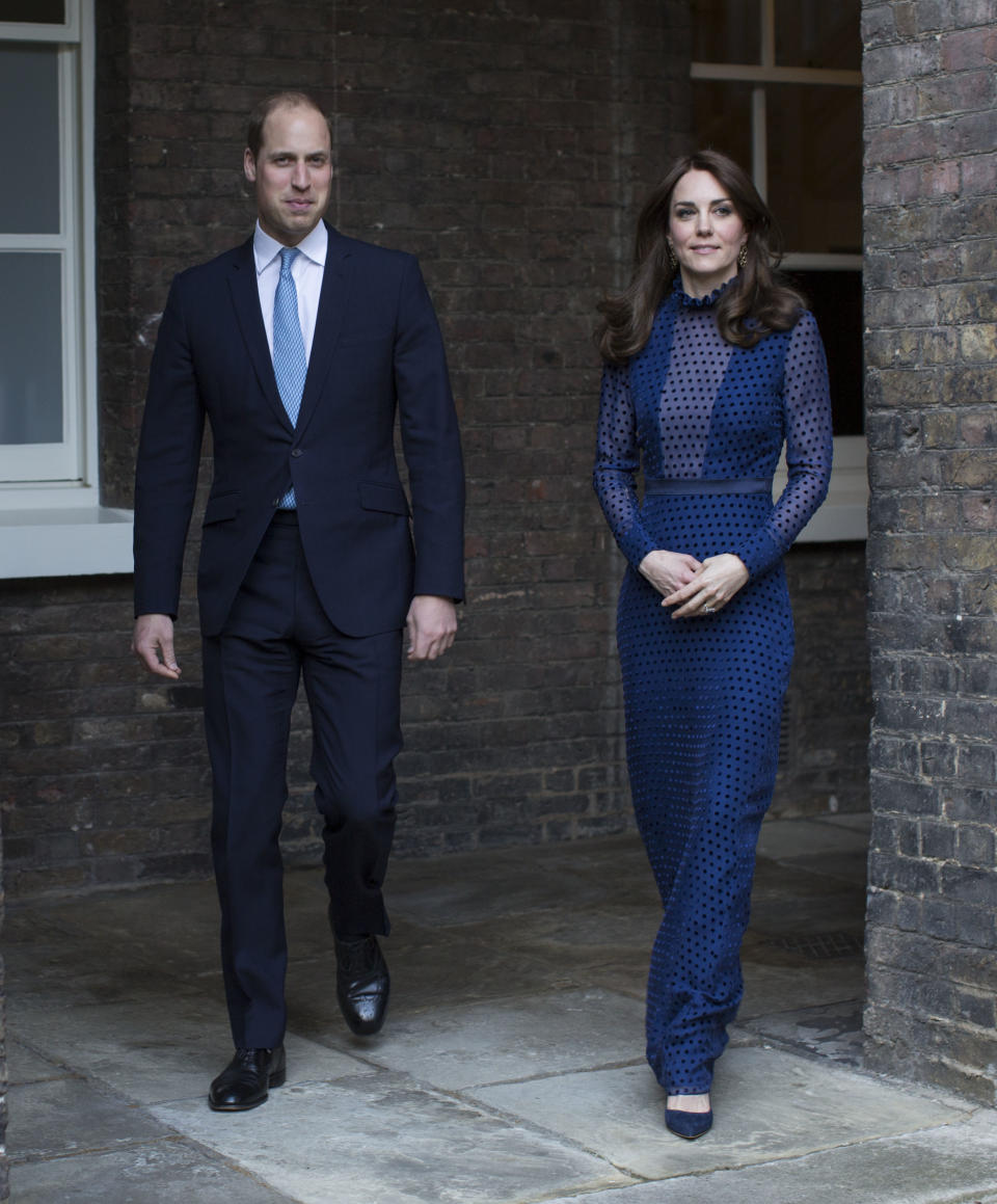 <p>Opting for a navy polka dot gown by Saloni, the Duchess of Cambridge attended a reception at Kensington Palace on April 4, 2016. She finished the look with a pair of co-ordinating Rupert Sanderson heels. <em>[Photo: PA]</em> </p>
