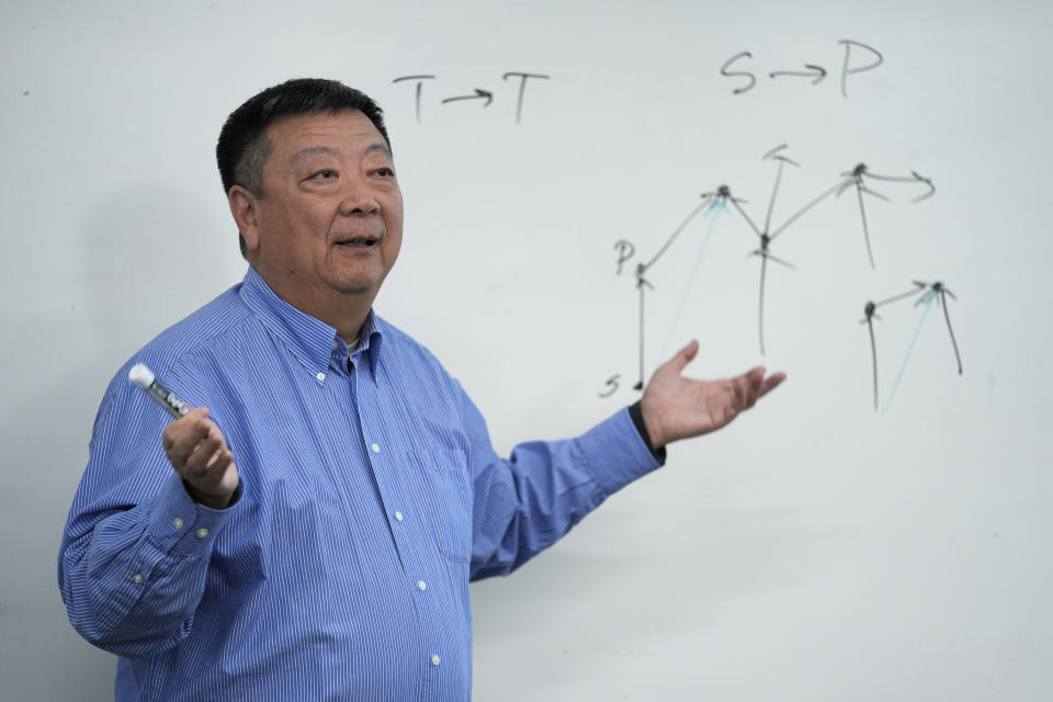 Dr. Pei Wang teaches a artificial general intelligence class at Temple University in Philadelphia, Thursday, Feb. 1, 2024. Mainstream AI research "turned away from the original vision of artificial intelligence, which at the beginning was pretty ambitious,” said Wang. (AP Photo/Matt Rourke)