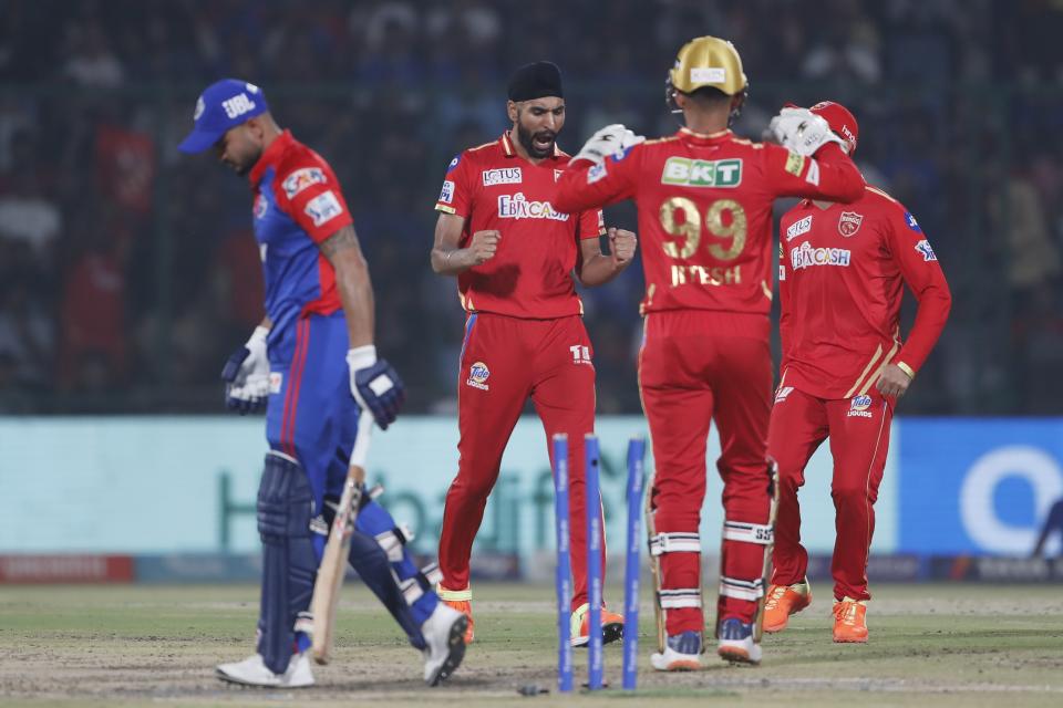 Harpreet Brar, second left, of Punjab Kings celebrates the dismissal of Delhi Capitals' Manish Pandey during the Indian Premier League cricket match between Delhi Capitals and Punjab Kings in New Delhi, India, Saturday, May 13, 2023. (AP Photo/Surjeet Yadav)