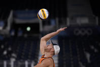 Alexander Brouwer, of the Netherlands, serves against the United States during a men's beach volleyball match at the 2020 Summer Olympics, Saturday, July 24, 2021, in Tokyo, Japan. (AP Photo/Felipe Dana)