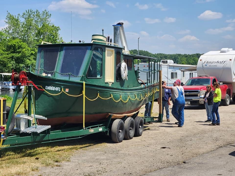 Members of a vintage steamboat club from Ohio prepare to get underway Saturday, June 10.