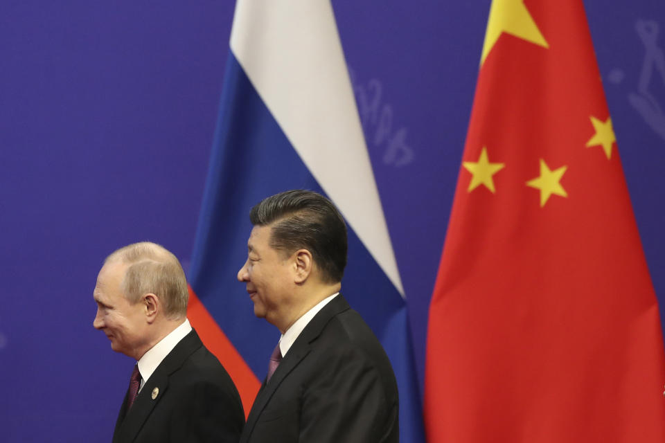 FILE - In this April 26, 2019, file photo, Russian President Vladimir Putin, left, and Chinese President Xi Jinping, right, attend an event at the Friendship Palace in Beijing. Putin and Xi have developed strong personal ties helping bolster a “strategic partnership” between the two former Communist rivals. (Kenzaburo Fukuhara/Pool Photo via AP, File)