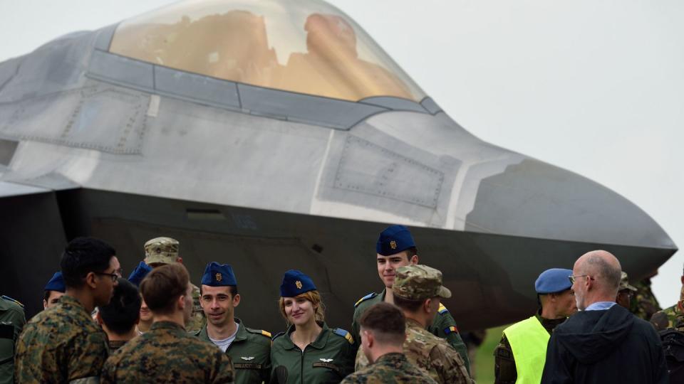 Romanian Air Force pilots look over a U.S. Air Force F-22 Raptor at the Mihail Kogalniceanu Air Base, near Constanta, Romania, in April 2016. (Daniel Mihailescu/AFP via Getty Images)