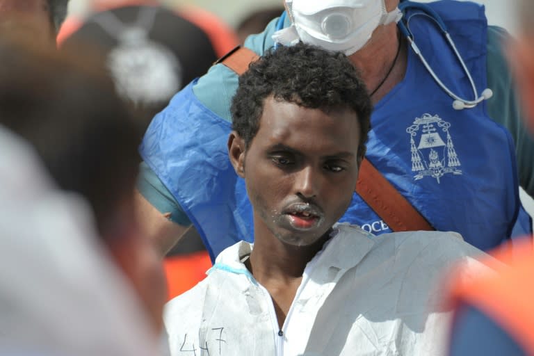 An Italian Navy ship arrives with more than 600 migrants on May 29, 2016 in southern Italy after a week of shipwrecks and death in the Mediterranean