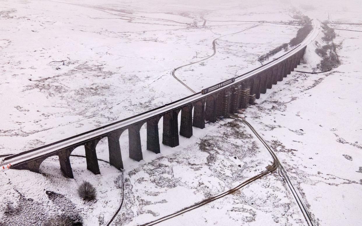 Heavy snow blanketed Ribblehead Viaduct in Yorkshire on Thursday - JAMES SPEAKMAN/MERCURY PRESS