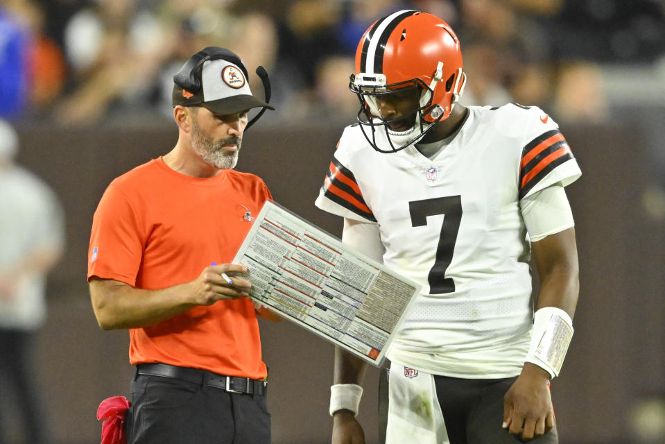 Cleveland Browns head coach Kevin Stefanski taels with Cleveland Browns quarterback Jacoby Brissett (7) during the first half of an NFL preseason football game against the Chicago Bears, Saturday, Aug. 27, 2022, in Cleveland. (AP Photo/David Richard)