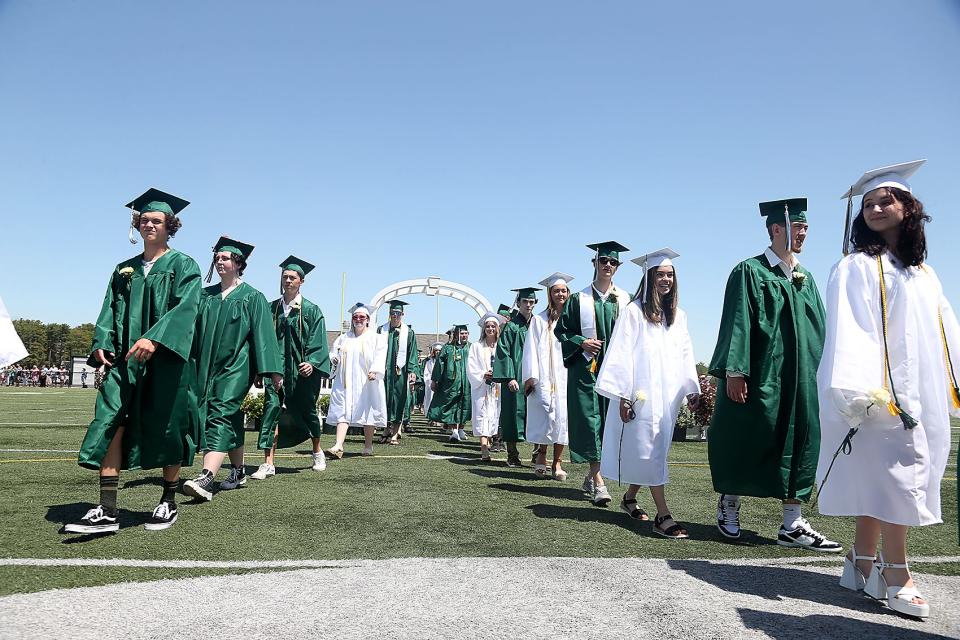 Members of the Class of 2022 make their way to their seats during Marshfield High's graduation at Marshfield High School on Saturday, June 4, 2022.