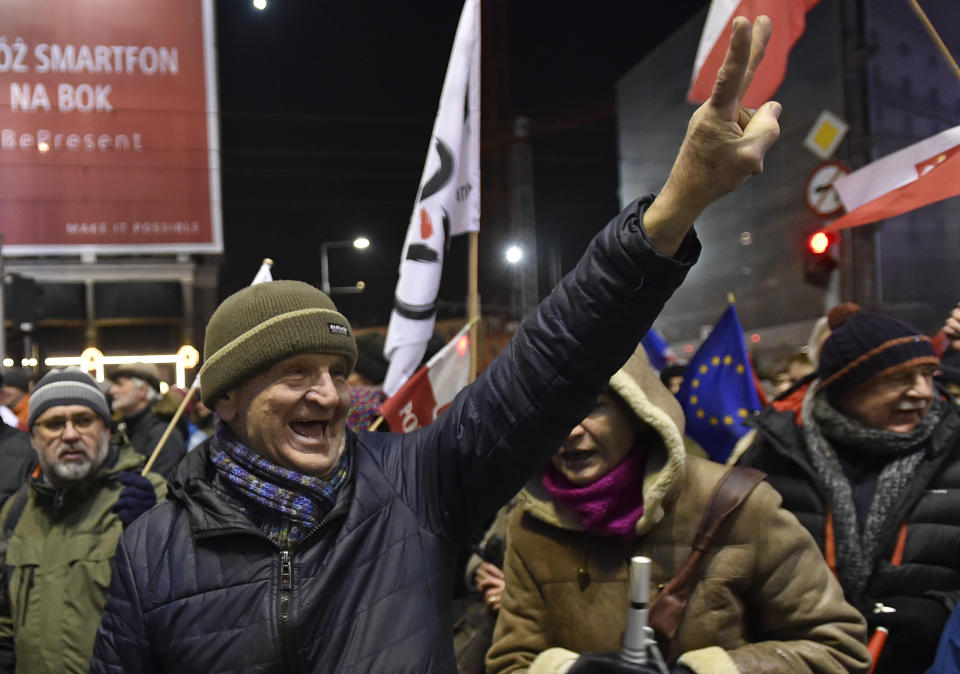 Anti-government protesters march through the downtown on the anniversary of imposition of the 1981 martial law by the country's former communist regime, in Warsaw, Poland, Tuesday, Dec. 13, 2016. (AP Photo/Alik Keplicz)