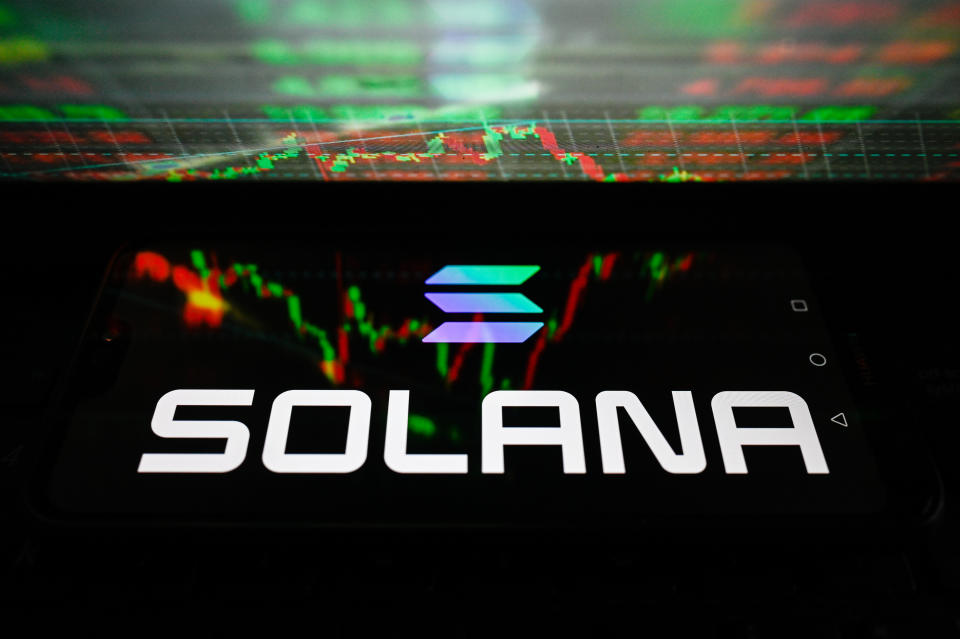 POLAND - 2023/10/27: In this photo illustration, Solana logo is displayed on a smartphone with stock market percentages reflections. (Photo Illustration by Omar Marques/SOPA Images/LightRocket via Getty Images)