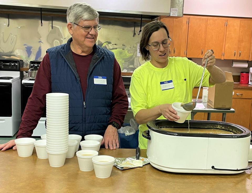 Coleman Anderson and Christa Ciotola dish up ham and bean soup for the first Lenten Lunch of 2023 at the Coshocton Presbyterian Church in 2023.