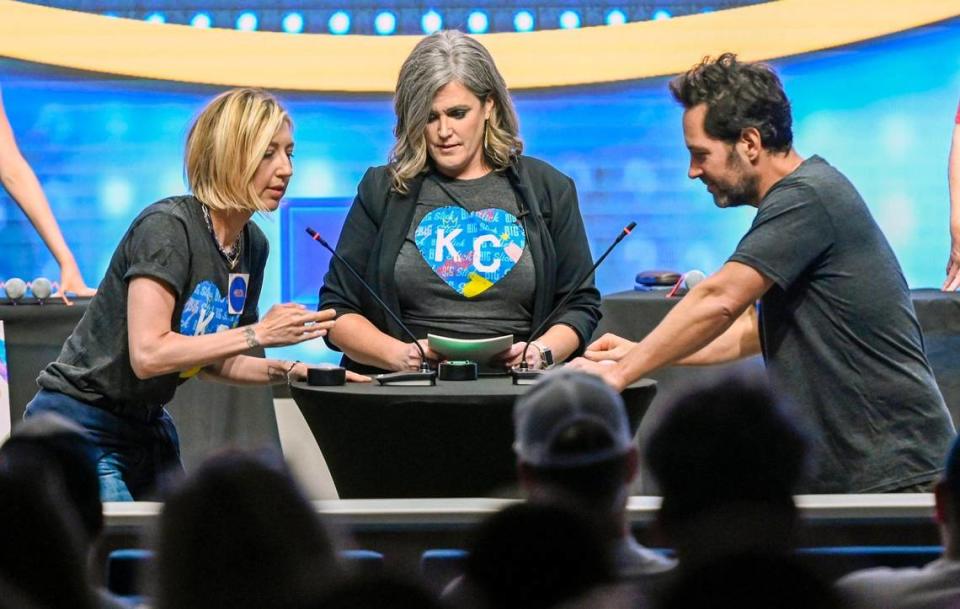 Big Slick Celebrity Weekend host Heidi Gardner, left, competed against Paul Rudd in a game of Friendly Feud in the Big Slick Auditorium at Children’s Mercy Hospital on Friday. Hospital employee Trisha Tate, center, was the game host.