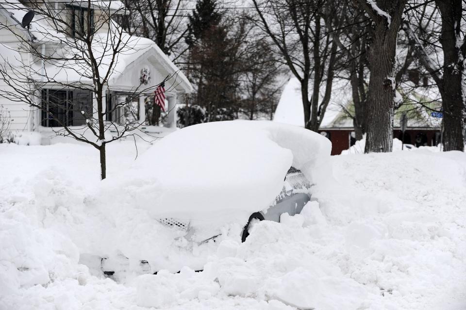 BUFFALO, NY - DECEMBER 26: A vehicle is abandoned long a residential street on December 26, 2022 in Buffalo, New York. The historic winter storm Elliott dumped up to four feet of snow on the area leaving thousands without power and twenty five confirmed dead in the city of Buffalo. (Photo by John Normile/Getty Images)