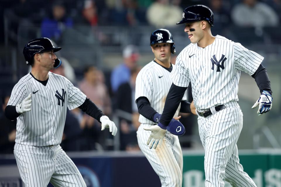 New York Yankees first baseman Anthony Rizzo (48) celebrates his three run home run against the Baltimore Orioles with shortstop Isiah Kiner-Falefa (12) and catcher Kyle Higashioka (66) during the third inning at Yankee Stadium.