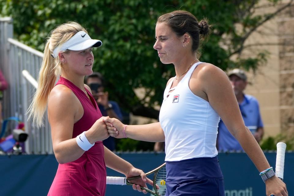 Peyton Stearns, of the United States, fist bumps doubles partner Emma Navarro, of the United States, during the Western & Southern Open at the Lindner Family Tennis Center in Mason on Wednesday, Aug. 16, 2023.