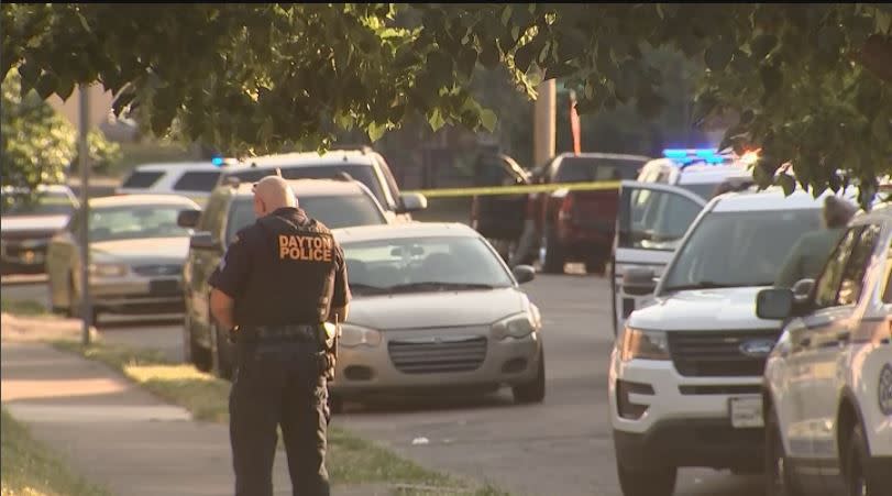 Dayton police investigate a shooting that left a man dead and sent four others to area hospitals Sunday on Superior Avenue. (Nate Russell/Staff)