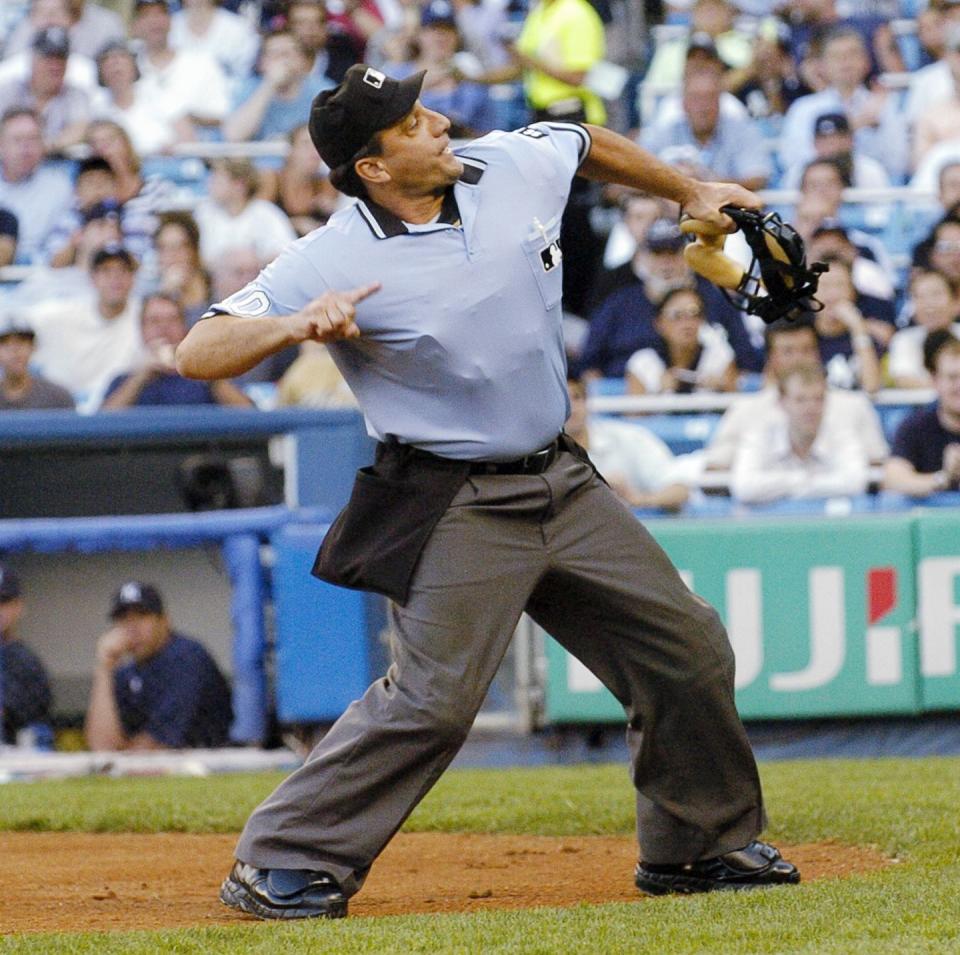 home plate umpire phil cuzzi signals the ejection of chicago