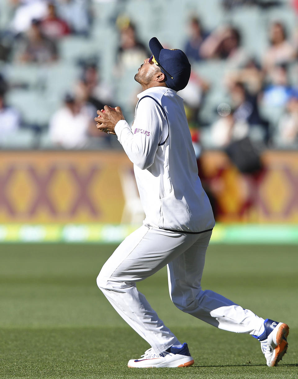 India's Mayank Agarwal catches out Australia's Marnus Labuschagne on the third day of their cricket test match at the Adelaide Oval in Adelaide, Australia, Saturday, Dec. 19, 2020. (AP Photo/David Mariuz)