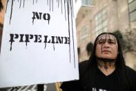 FILE PHOTO: People protest against President Donald Trump's executive order fast-tracking the Keystone XL and Dakota Access oil pipelines in Los Angeles