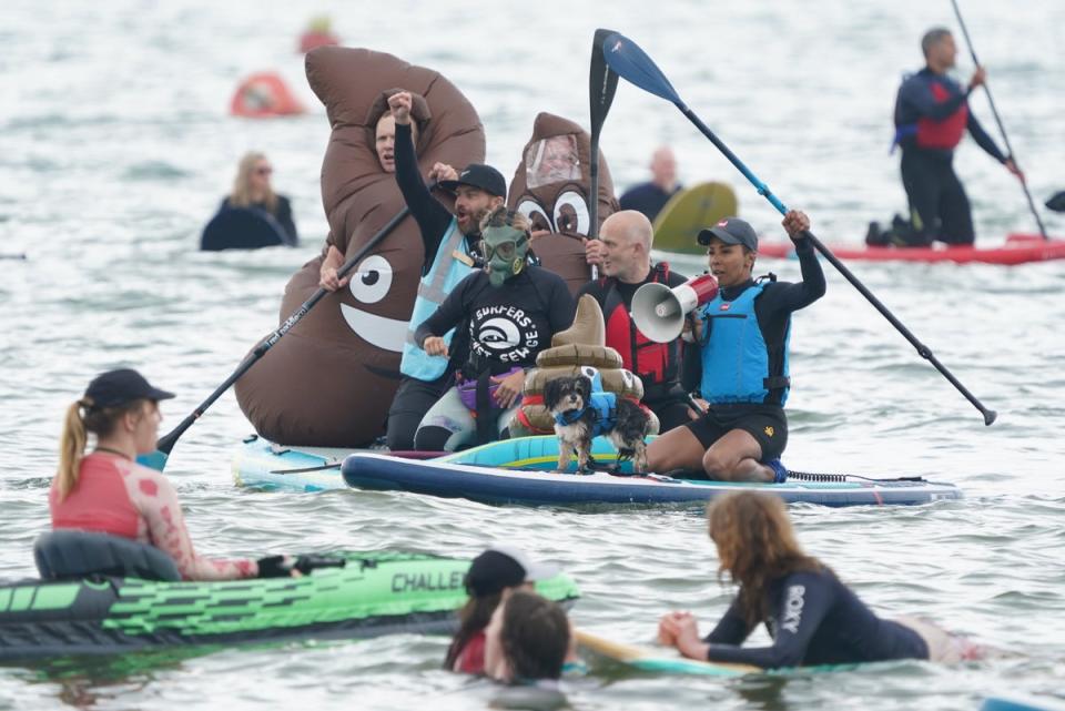 Olympian and paddleboarder Kelly Holmes during Surfers Against Sewage’s Paddle-Out Protest in Brighton (PA)