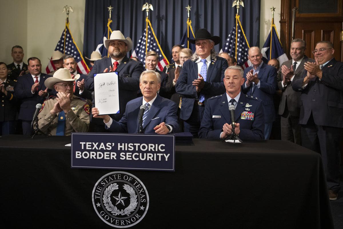 Gov. Greg Abbott, displays SB 1900, one of six bills he signed during a border security bill signing session at the state capitol in Austin on June 8, 2023. The bills signed include SB 423, SB 602, SB 1133, SB 1403, SB 1484, and SB 1900. “Washington D.C. has failed to do its job to secure the border,” Abbott said. “As a result, Texas has had to take unprecedented steps in responding to the crisis caused by the Biden administration on the border, and in response the Texas legislature has stepped up to make sure that we will be able to more robustly respond.”