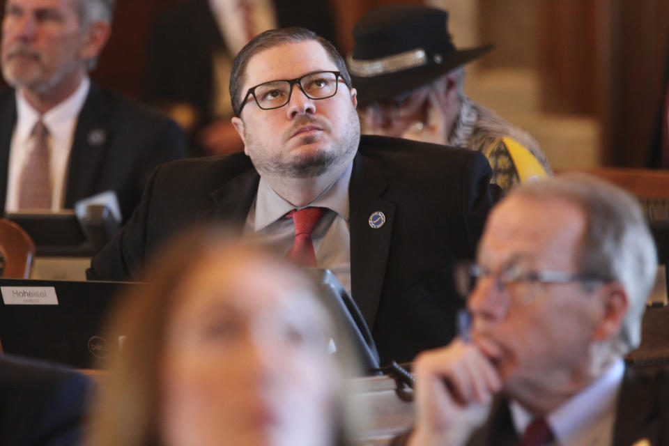 Kansas state Rep. Nick Hoheisel, R-Wichita, watches an electronic tally board as the House votes on legislation, Wednesday, March 27, 2024, at the Statehouse in Topeka, Kan. The Kansas House has a new plan for cutting taxes and has backed off a previous GOP proposal for a "flat" personal income tax with a single rate rather than the current three rates. (AP Photo/John Hanna)