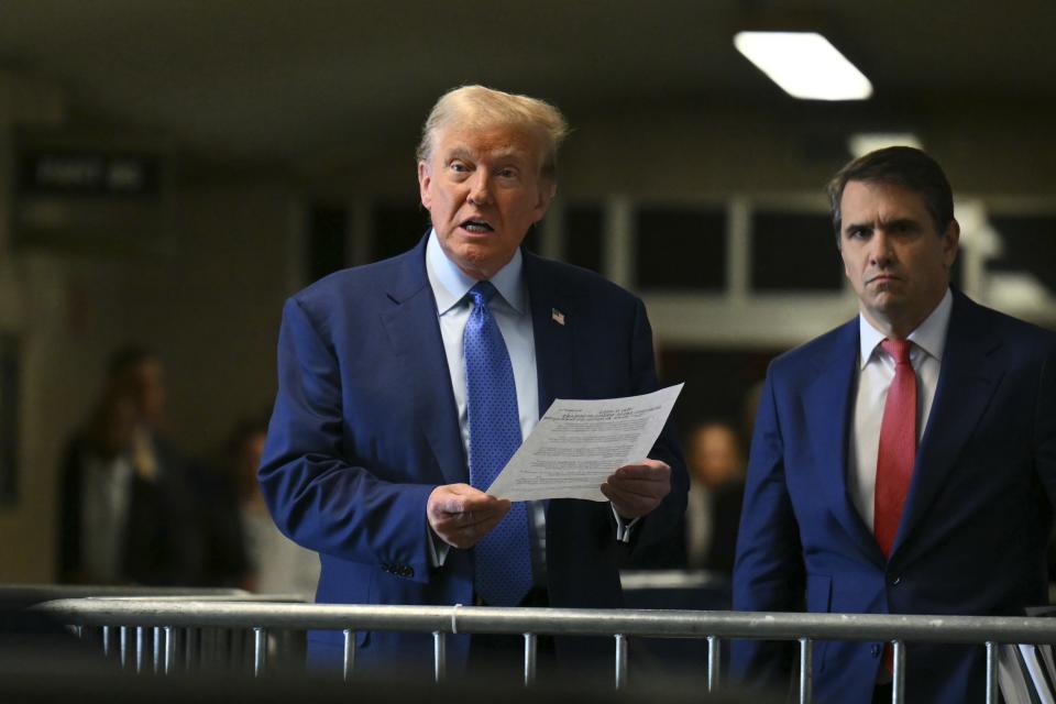 Former President Donald Trump speaks to reporters next to lawyer Todd Blanche at Manhattan Criminal Court in New York, Thursday, May 9, 2024. (Angela Weiss/Pool Photo via AP)