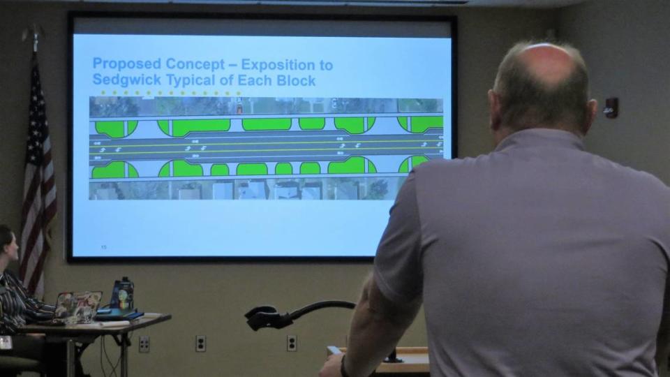 Interim City Engineer Paul Gunzelman narrates a slide show on the Douglas Avenue project at Monday’s meeting of the District 4 Advisory Board.