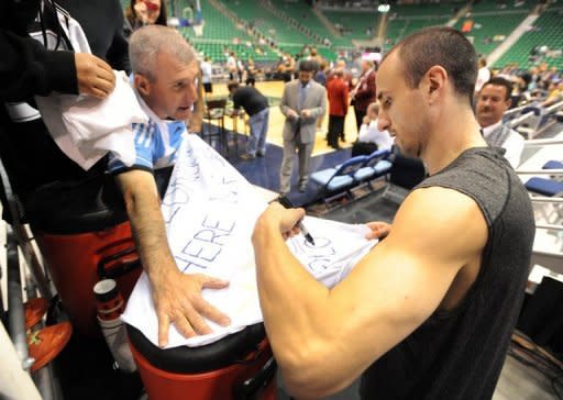 Manu Ginobili of the San Antonio Spurs signs autographs before Game Three of the Western Conference Quarterfinals in the 2012 NBA Playsoffs at EnergySolutions Arena, on May 5, in Salt Lake City, Utah. The Spurs won 102-90, extending the series lead to 3-0