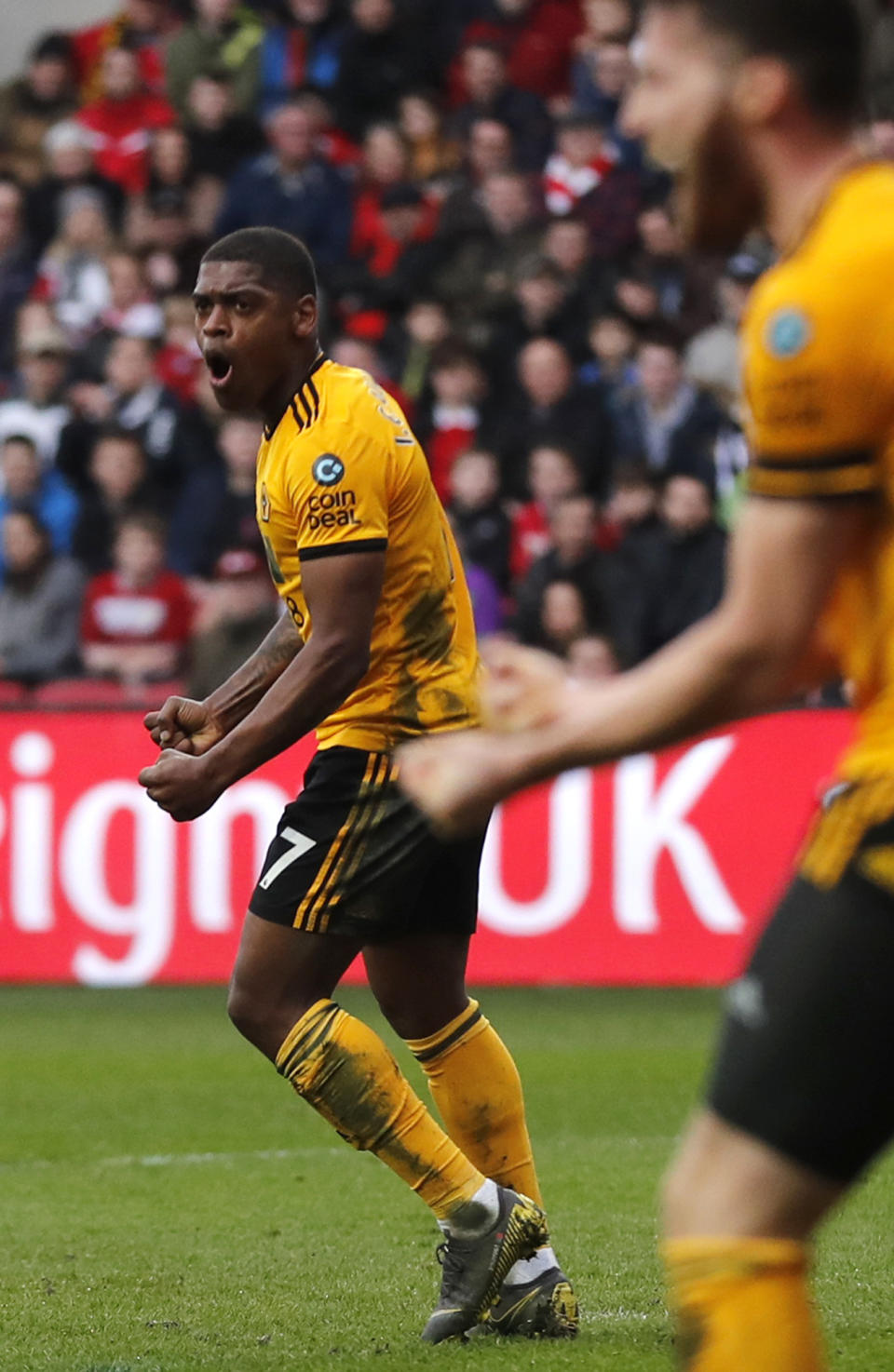 Wolverhampton's Ivan Cavaleiro, left, celebrates after scoring the opening goal during the English FA Cup fifth round soccer match between Bristol City and Wolverhampton Wanderers at Ashton Gate stadium in Bristol, England, Sunday, Feb. 17, 2019. (AP Photo/Frank Augstein)