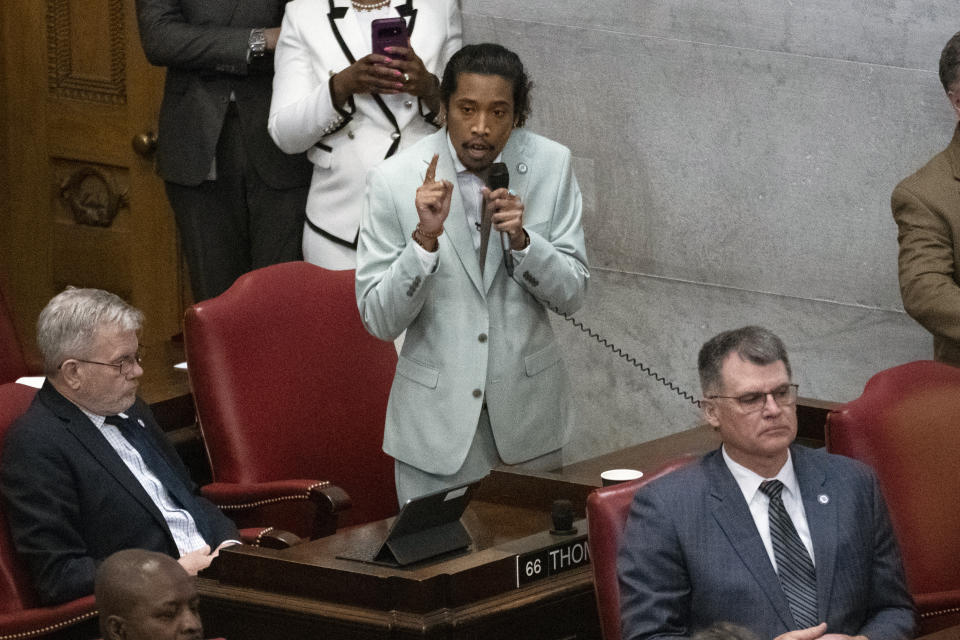 State Rep. Justin Jones, D-Nashville, delivers remarks from his desk in the House chamber, Monday, April 10, 2023, in Nashville, Tenn. Jones was appointed to represent District 52 by the Metro Nashville City Council earlier in the day after being expelled the previous week for using a bullhorn to shout support for pro-gun control protesters in the House chamber. (AP Photo/George Walker IV)