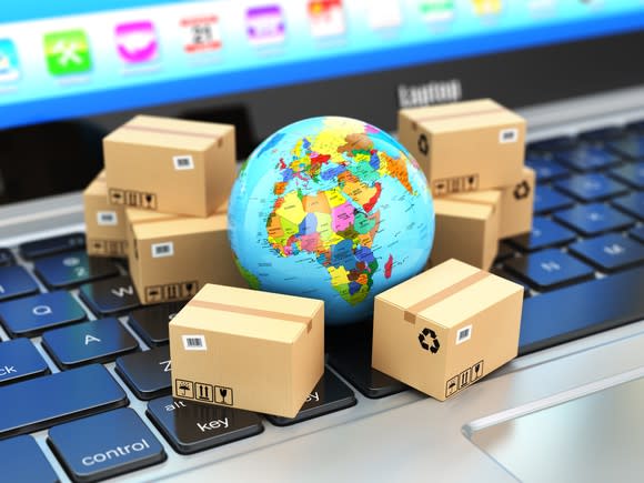 A global surrounded by boxes on a computer keyboard.