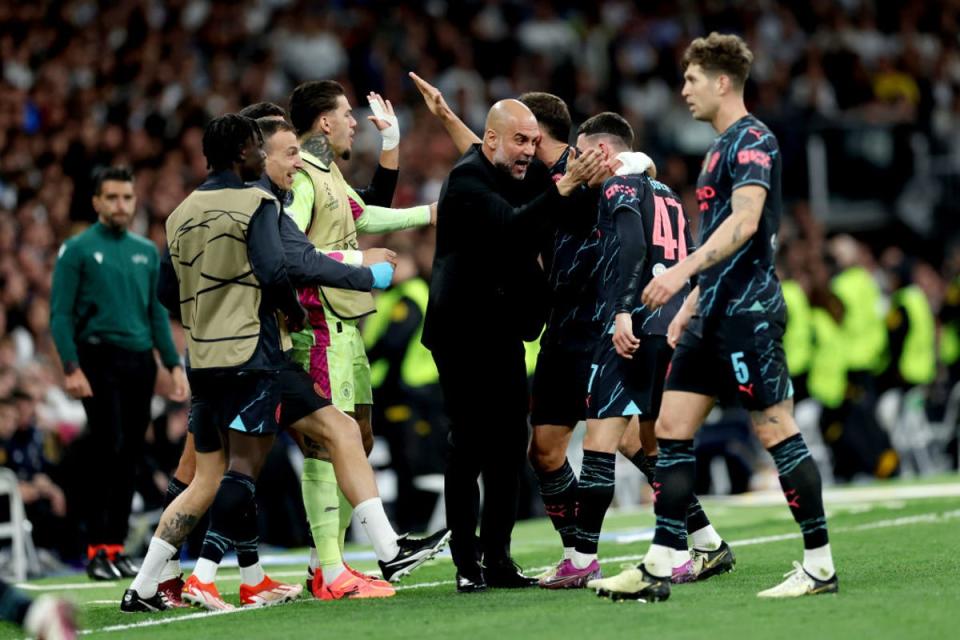 Pep Guardiola celebrates with Phil Foden and Ruben Dias (Getty)