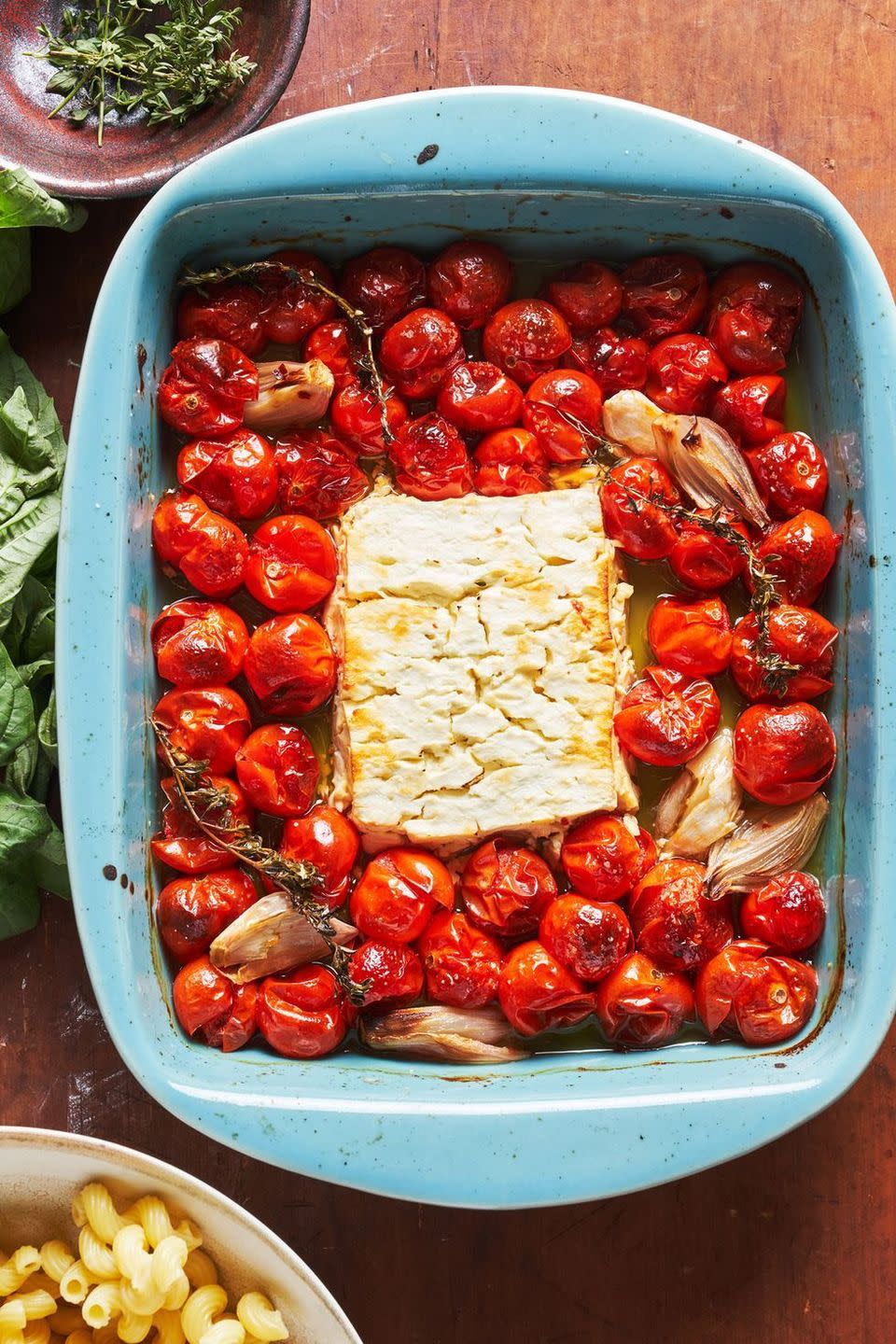 <p>Obviously roasting a block of feta with bursting tomatoes is going to be amazing. But is it good enough to break the internet? Our answer, begrudgingly, is yes. It's genius! </p><p>Get the <a href="https://www.delish.com/uk/cooking/recipes/a35426947/baked-feta-pasta-tiktok/" rel="nofollow noopener" target="_blank" data-ylk="slk:Baked Feta Pasta;elm:context_link;itc:0;sec:content-canvas" class="link ">Baked Feta Pasta</a> recipe.</p>