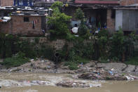 Drainage pipes empty into the Bishnumati River, a tributary of the Bagmati River, in Kathmandu, Nepal, Thursday, May 26, 2022. (AP Photo/Niranjan Shrestha)