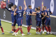 The Chicago Fire celebrate a goal by midfielder Luka Stojanovic (8) against the New England Revolution during the first half of an MLS soccer match in Chicago, Saturday, April 17, 2021. (AP Photo/Mark Black)