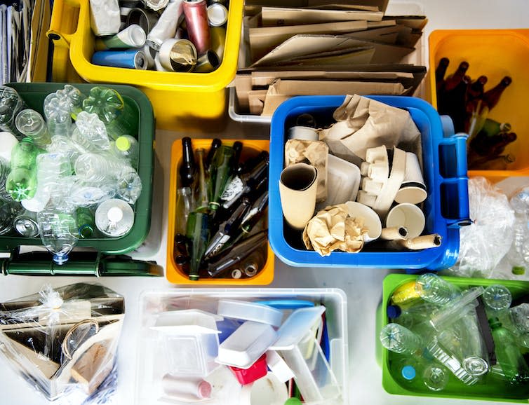 Recycling boxes filled with recycling.