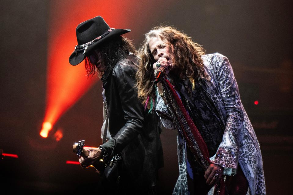 Joe Perry (left) and Steven Tyler of Aerosmith perform live on stage in Philadelphia on opening night of their Peace Out tour.