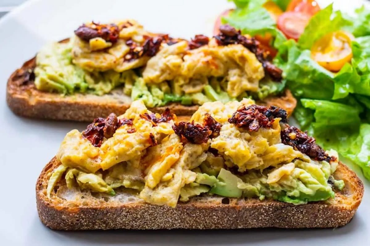 <p>2 Food Trippers</p><p>Layering mashed avocado and egg over toast and then sprinkling chili crisp on top to get this delicious go-to breakfast sandwich.</p><p><strong>Get the recipe here: <a href="https://www.2foodtrippers.com/avocado-egg-toast-with-chili-crisp/" rel="nofollow noopener" target="_blank" data-ylk="slk:Avocado Egg Toast with Chili Crisp;elm:context_link;itc:0;sec:content-canvas" class="link rapid-noclick-resp">Avocado Egg Toast with Chili Crisp</a></strong></p>