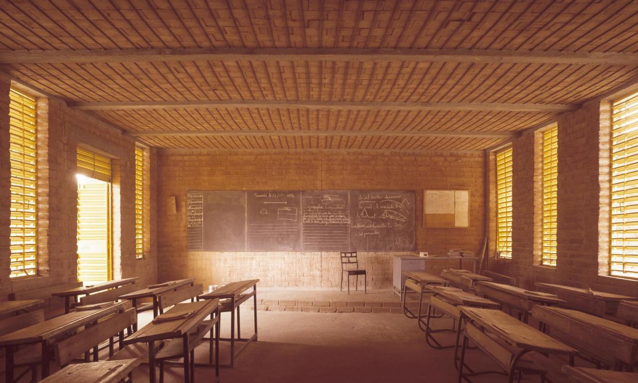 <span>Gando primary school, Diébédo Francis Kéré’s first construction project after finishing his studies in Germany. </span><span>Photograph: Siméon Duchoud/Kere Architecture</span>