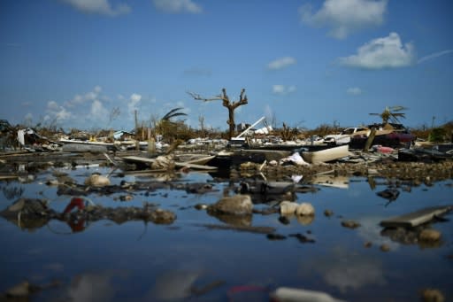 Belongings litter the ground amid the devastated remains of the shantytown known as The Mudd in Marsh Harbour, the Bahamas, on September 7, 2019