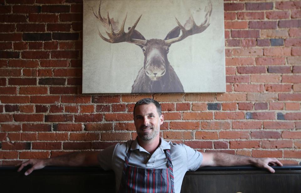 Chef Gregg Sessler is seen in the Odd Fellows Tavern in South Berwick, Maine, which he and his wife, Kristin, opened at the start of the coronavirus pandemic in 2020.