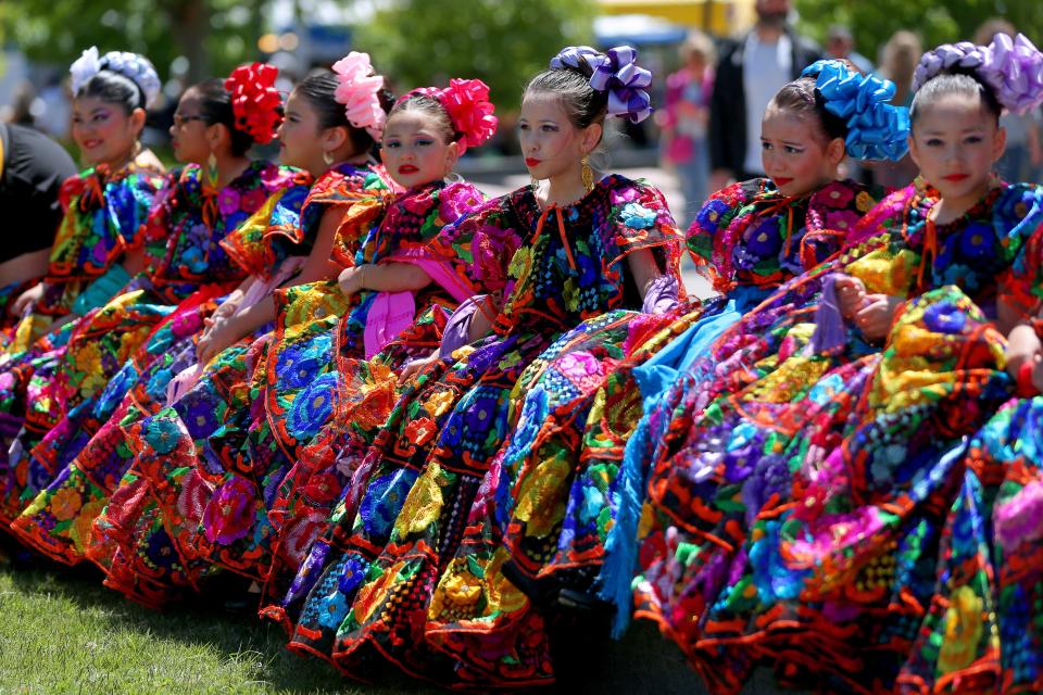 Dancers with Yumare Mexican Folkloric Dancers Inc. line up for a photos April 29, 2023, during the Festival of the Arts.