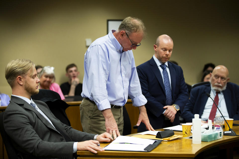 Michael Meyden, center left, who is accused of drugging his daughter's friends at a sleepover in 2023, stands to read a statement in Clackamas County Circuit Court in Oregon City, Oregon, on Monday, June 10, 2024. (Dave Killen/The Oregonian via AP)