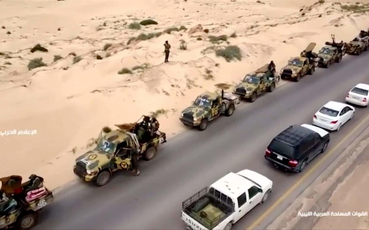 An aerial view shows military vehicles on a road in Libya, April 4, 2019, in this still image taken from video - REUTERS