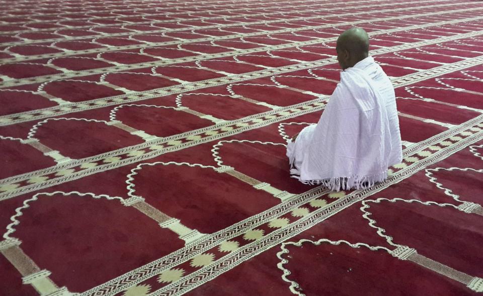 Muslim man attends prayers for Umrah, at Taneem Mosque in the Al-Hil area of the holy city of Mecca